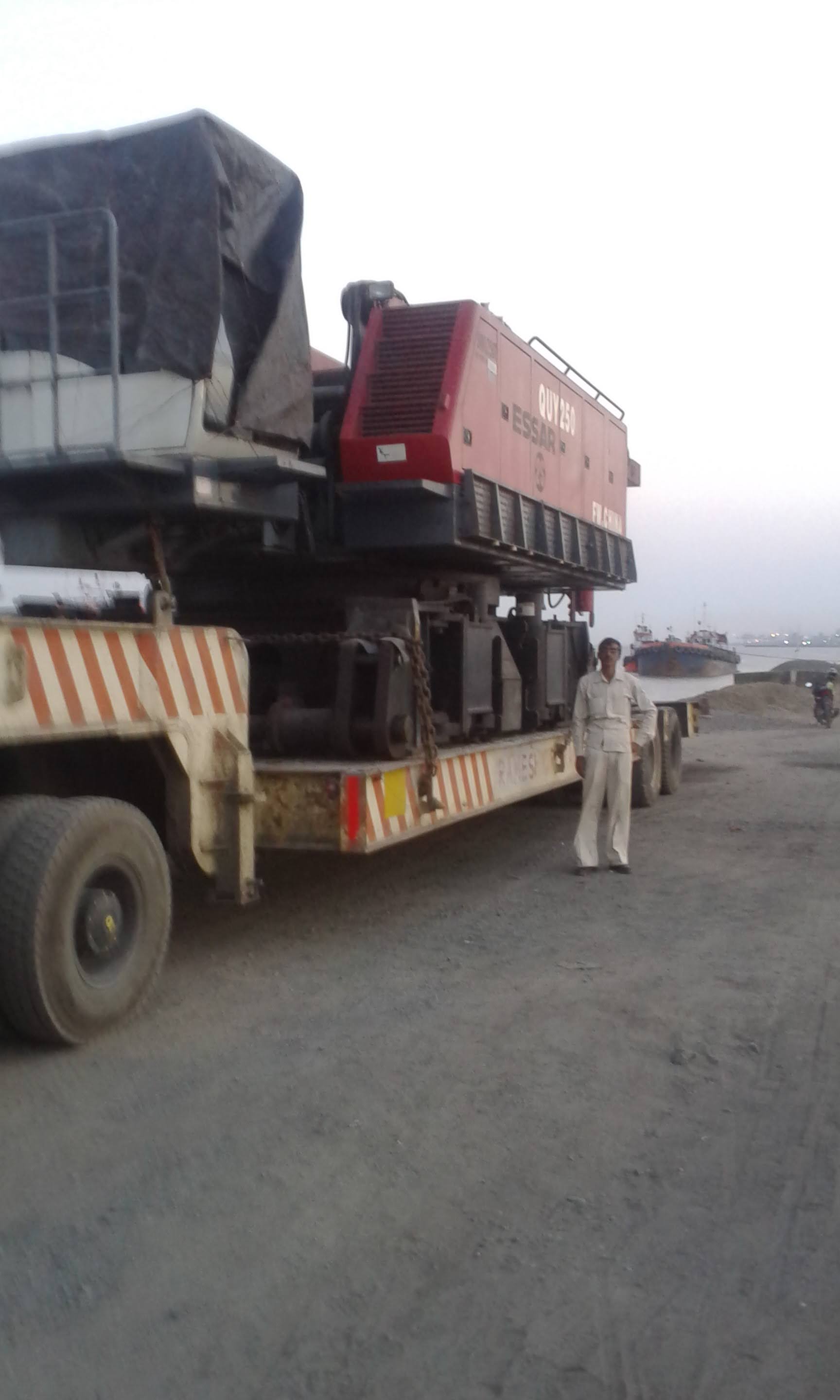 Low-bed trailer carrying heavy crane machinery